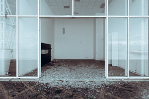 Abandoned vandalized empty building, an Industrial Photo by SkyNext