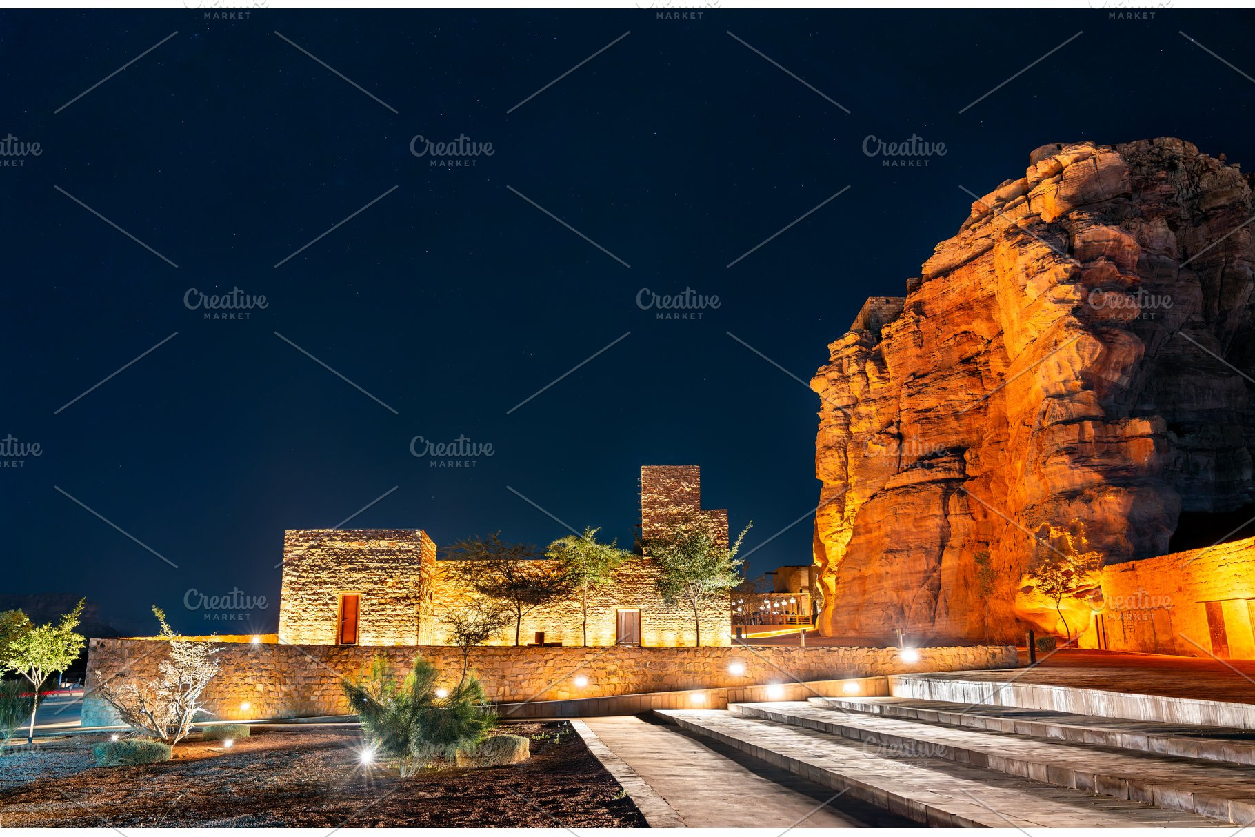 Illuminated traditional stone buildings in AlUla Old Town, an Architecture Photo by Leonid Andronov