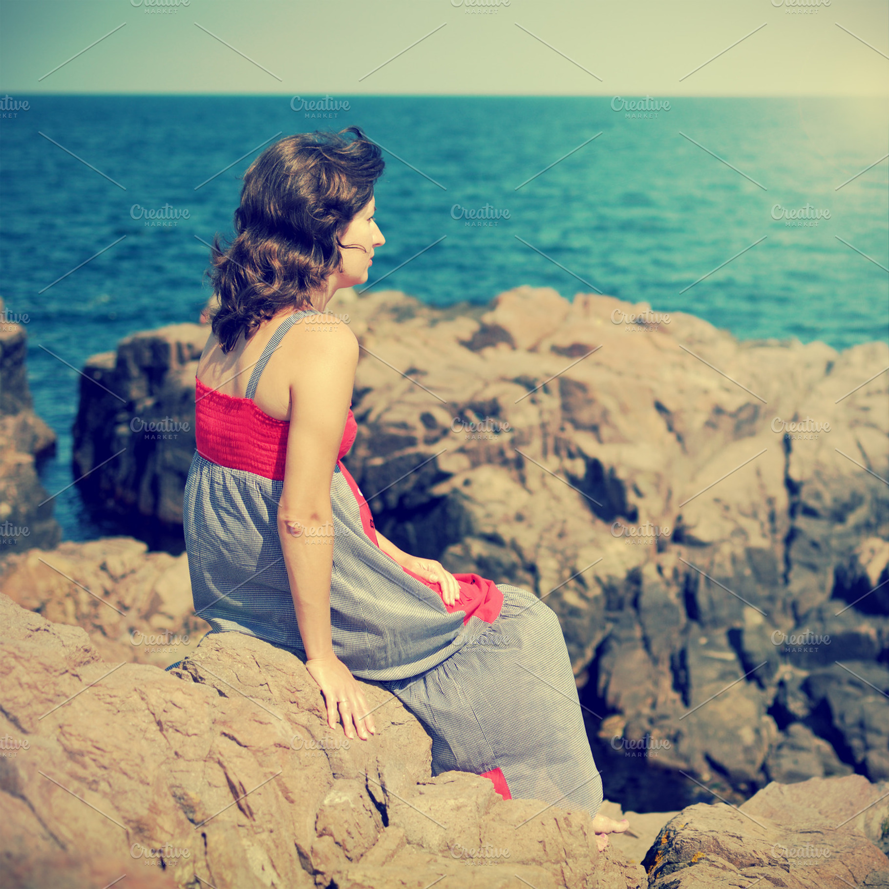 Lonely woman featuring woman, sea, and rock