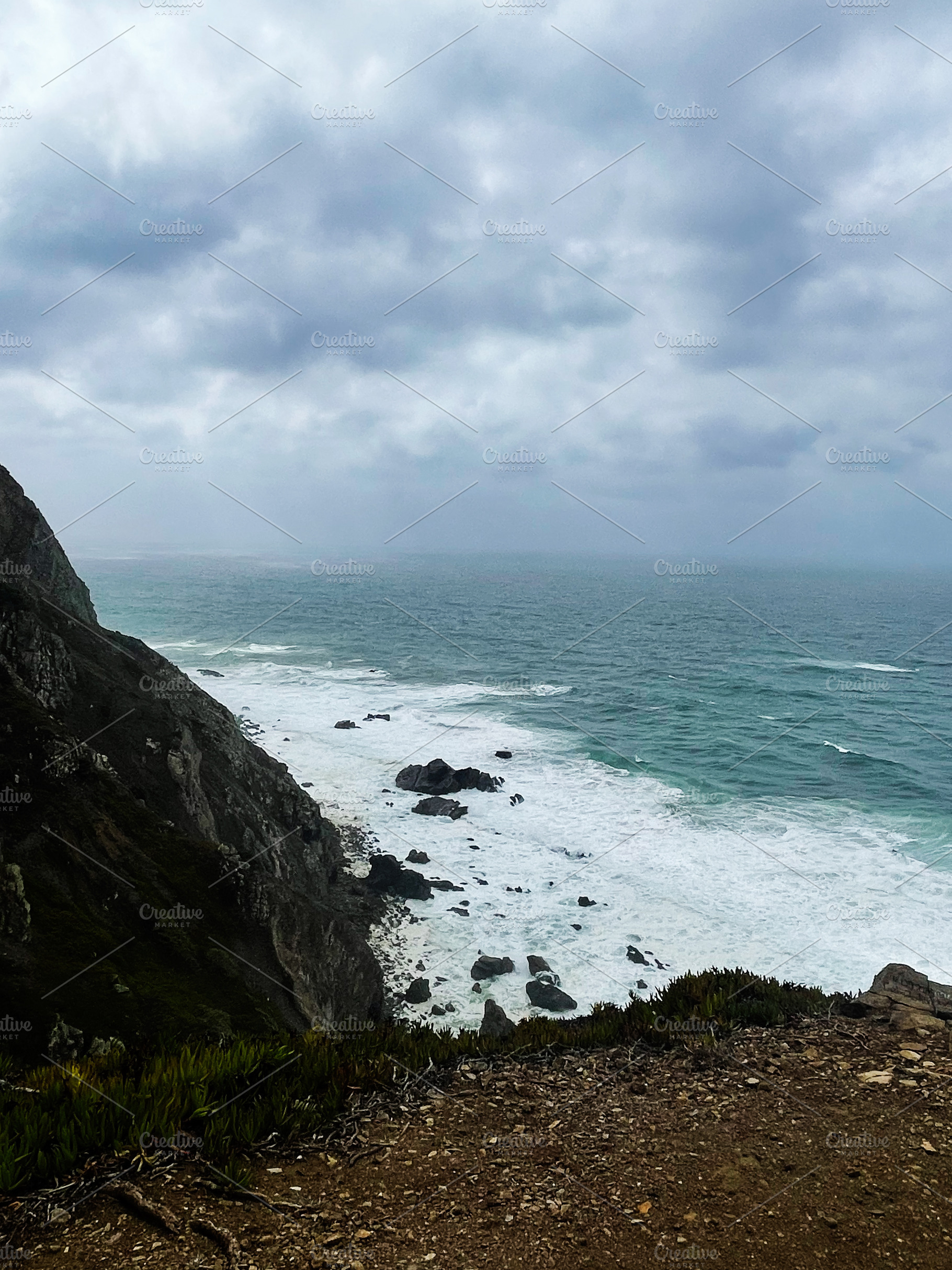 Cliffside coastline above the Atlantic Portugal, during a cloudy stormy day, a Photo by AS photostudio