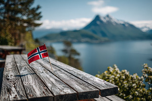 Norwegian flag on wooden table sceni, a Photo by Pixeness Studio