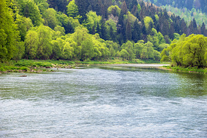Spring picturesque river band view. Mountains scenery view behin