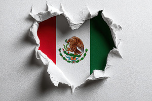 Mexican flag heart shaped hole torn, a Photo by Pixeness Studio