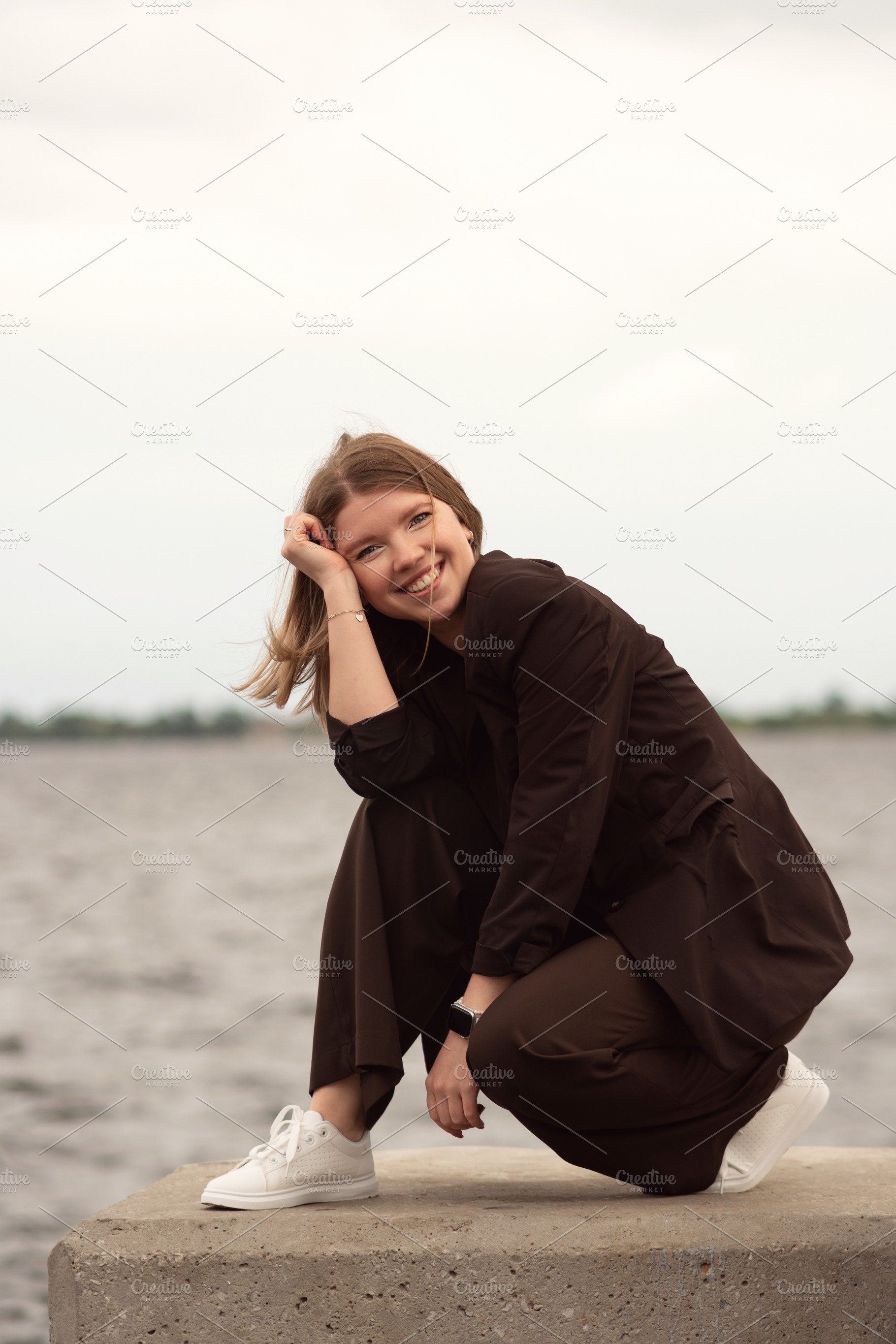 Smiling woman in brown suit, a Person Photo by Elena Vagengeim