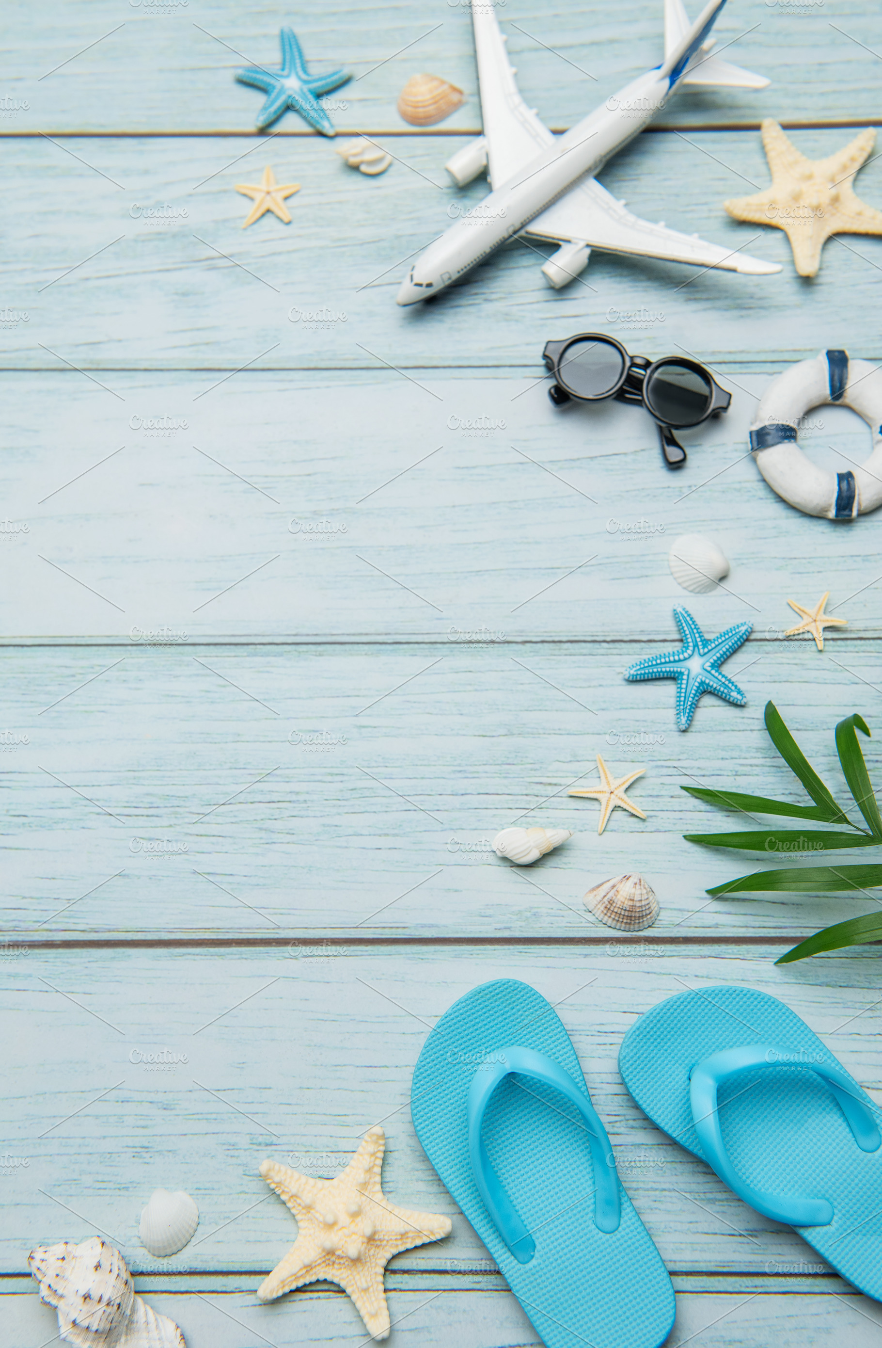 Planning summer vacation with airplane, flip flops and seashells, a Holiday Photo by Olena Rudo