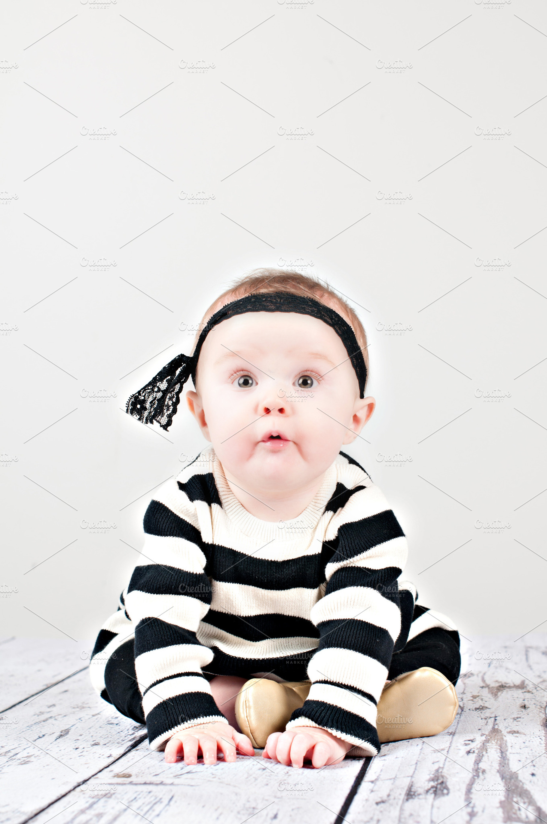 Cheeky baby girl stock picture, a Person Photo by Persnickety Prints