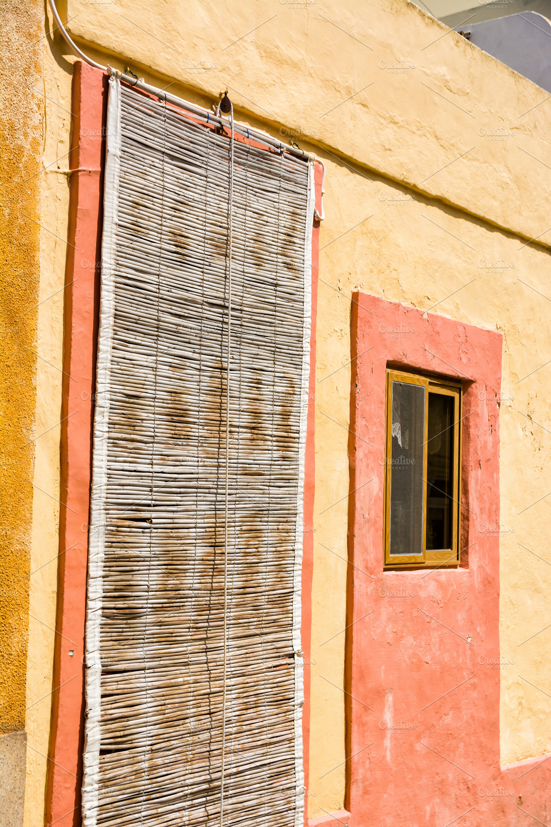 Typical door in Maltese villages with bamboo curtain cover, an Architecture Photo by Angelo D'Amico Photograph
