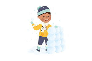 Cheerful Boy Building Snow Tower