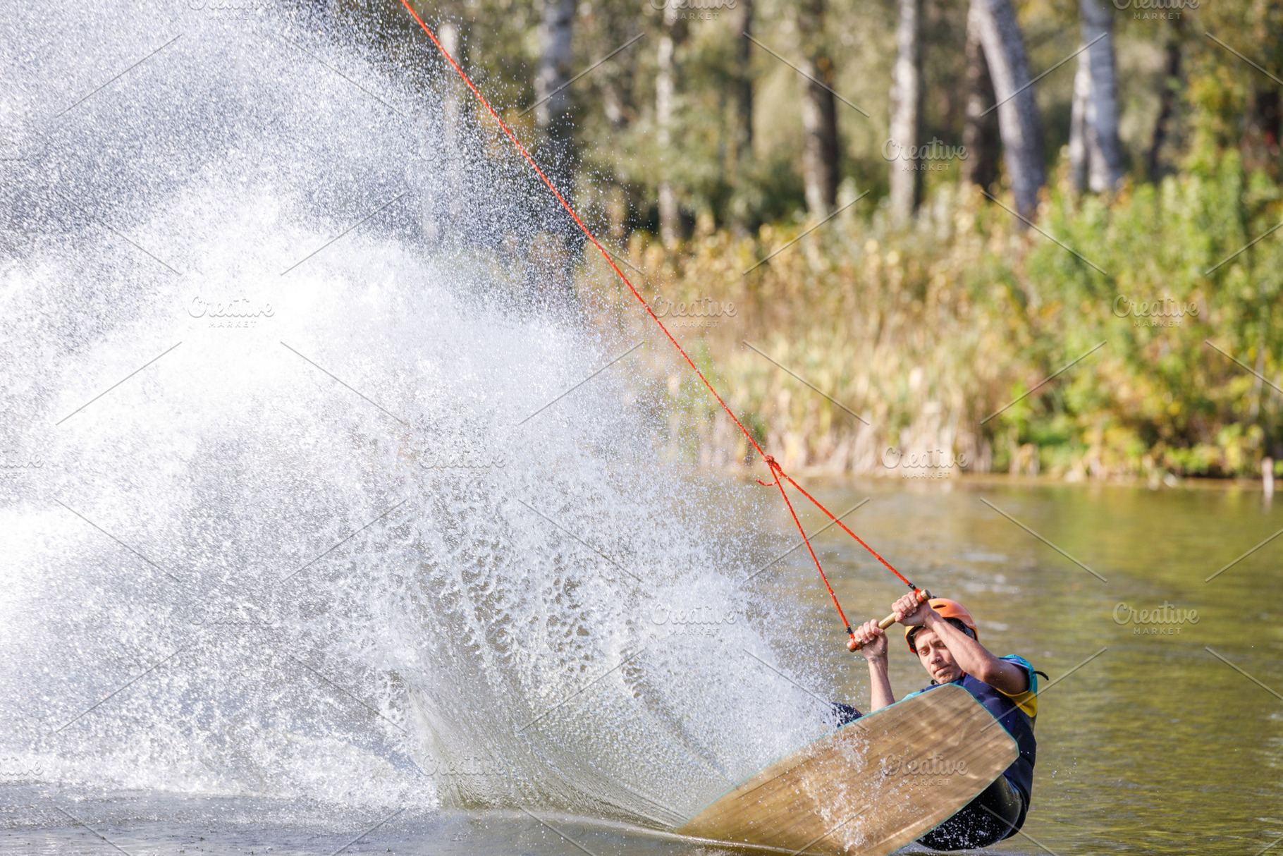 Sportsman on wakeboard falling after a trick on his back, a Sports & Recreation Photo by serkum