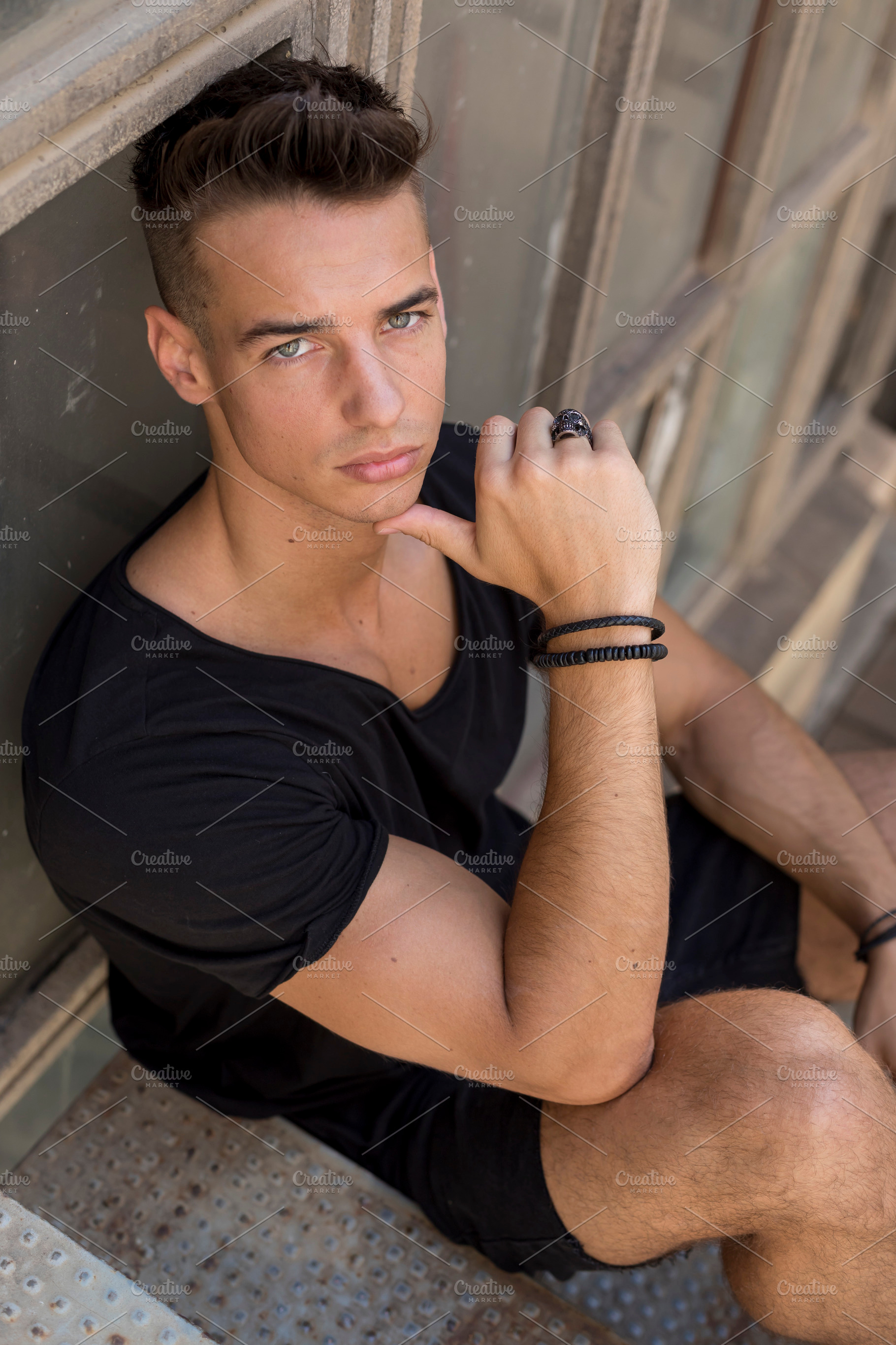 Serious young man posing in sunlight outdoors, a Person Photo by RF Images