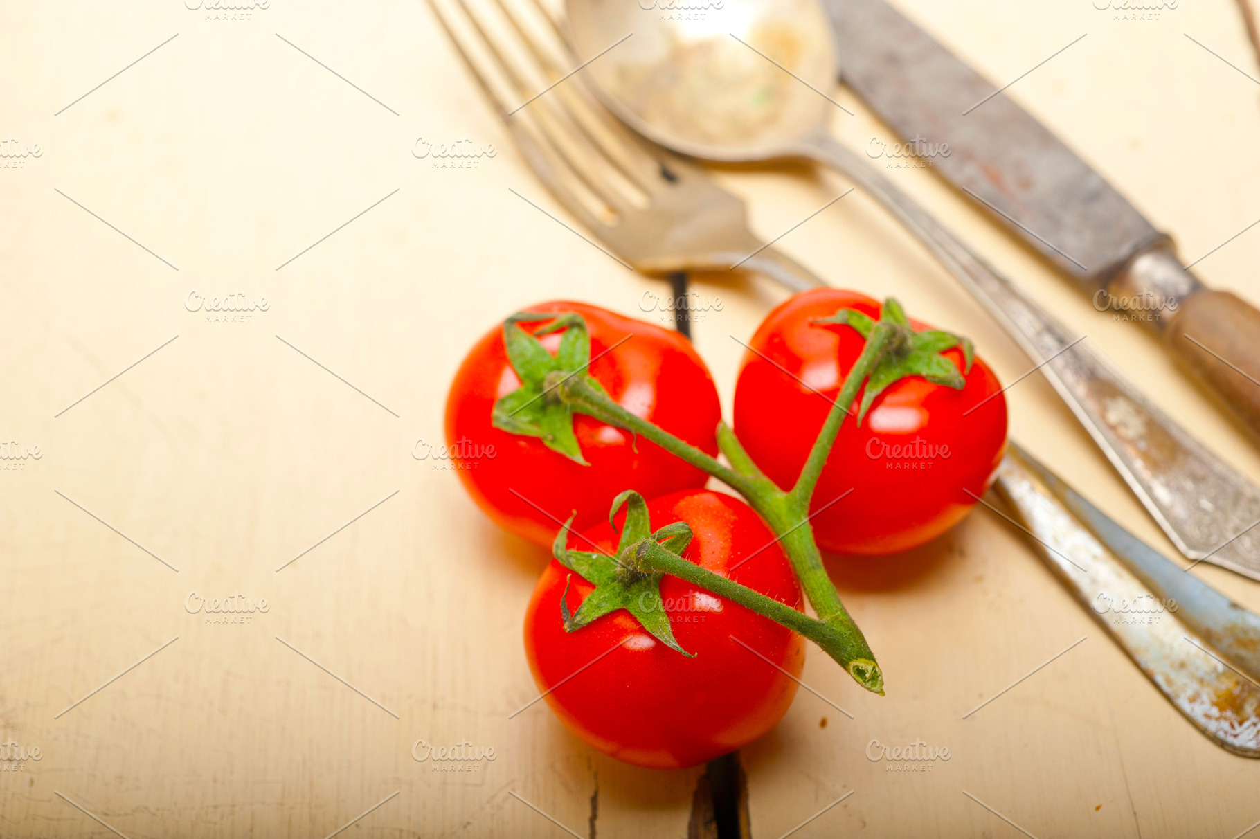 ripe cherry tomatoes over white wood, a Food & Drink Photo by keko64