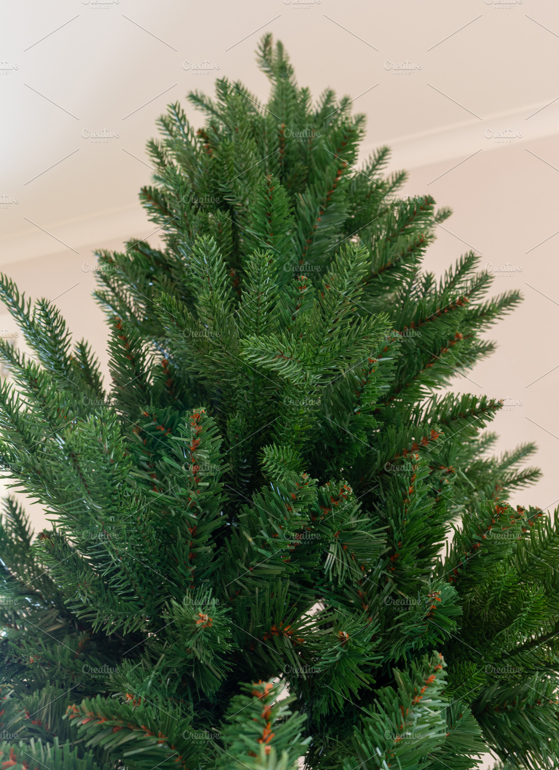 Synthetic Christmas tree branches ready for holiday decoration, a Holiday Photo by Antonio Gravante Market