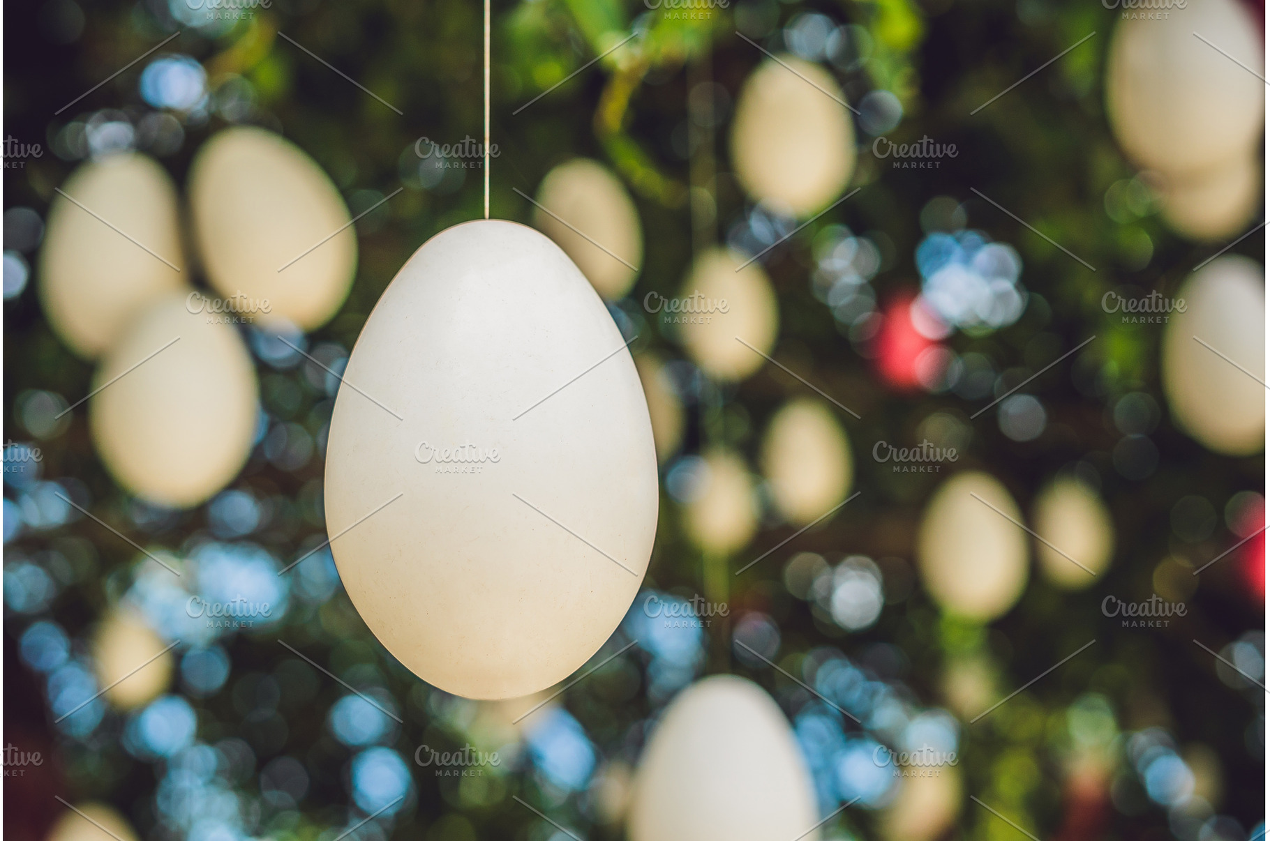 Easter eggs hang on ropes on a tree., an Arts & Entertainment Photo by Elizaveta Galitskaya