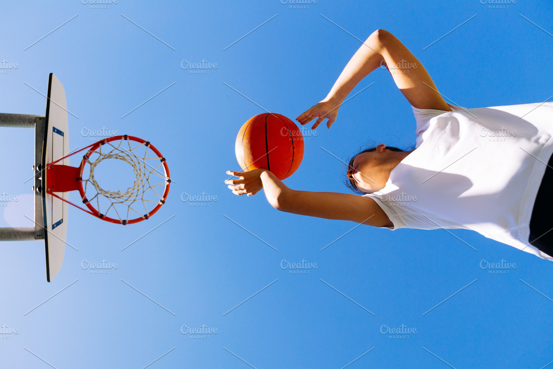 Young girl shooting basket outdoors featuring basketball, sport, and teen, a Sports & Recreation Photo by asife