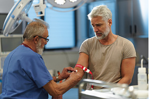 Doctor drawing blood from patient's, a Health & Medical Photo by HalfPoint