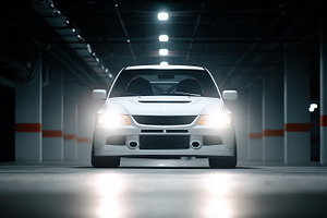 White sports car with headlights on, a Transportation Photo by MistyDay