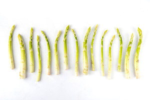Raw fresh organic asparagus on white background, a Food & Drink Photo by Rimma