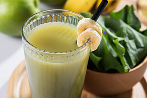 Green smoothie with spinach,banana, apple, and lemon on wooden tablespace, a Food & Drink Photo by etorres69