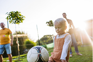 Little boy playing football with, a Sports & Recreation Photo by HalfPoint