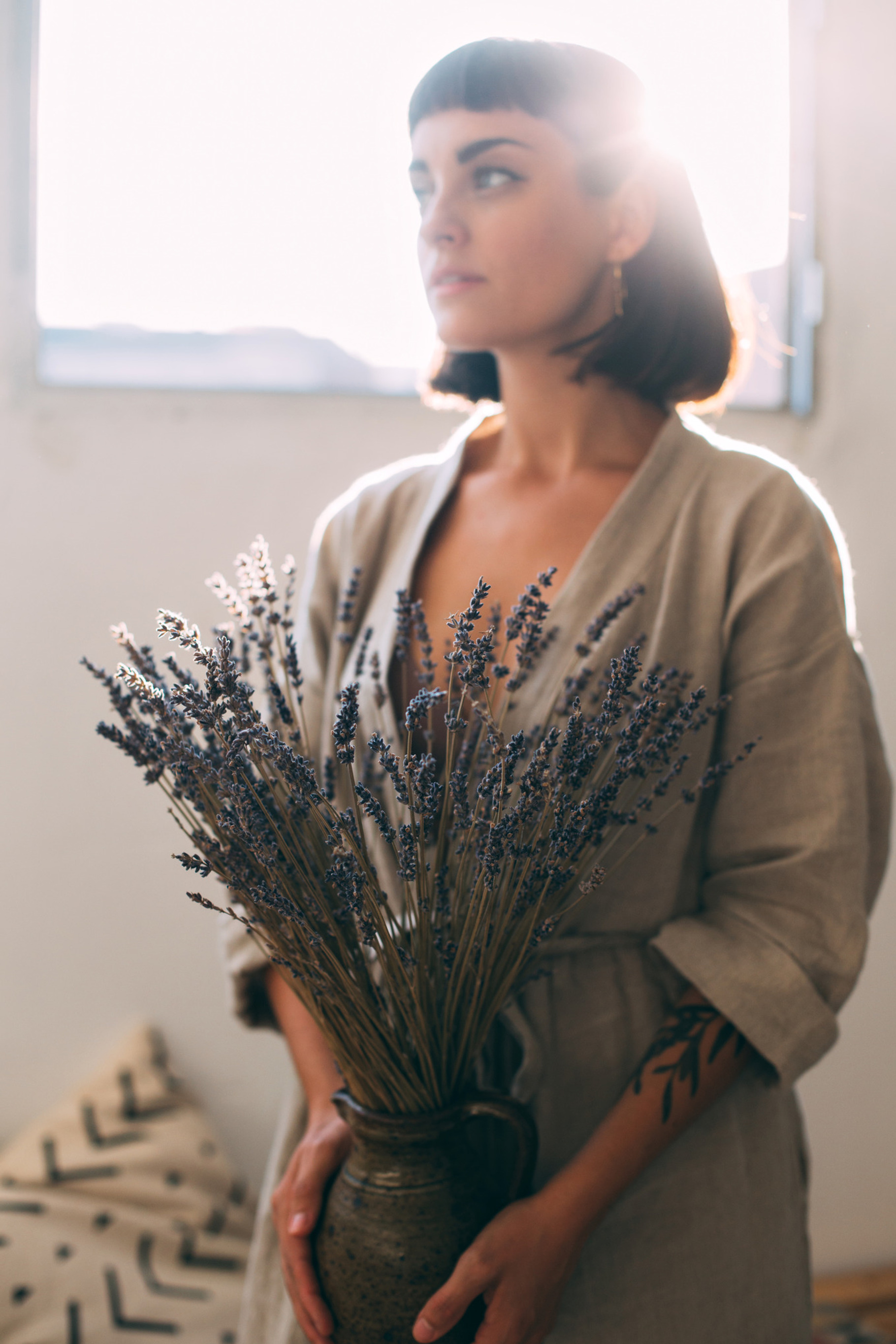Artisan sensual woman holds lavender, a Beauty & Fashion Photo by DeRepente