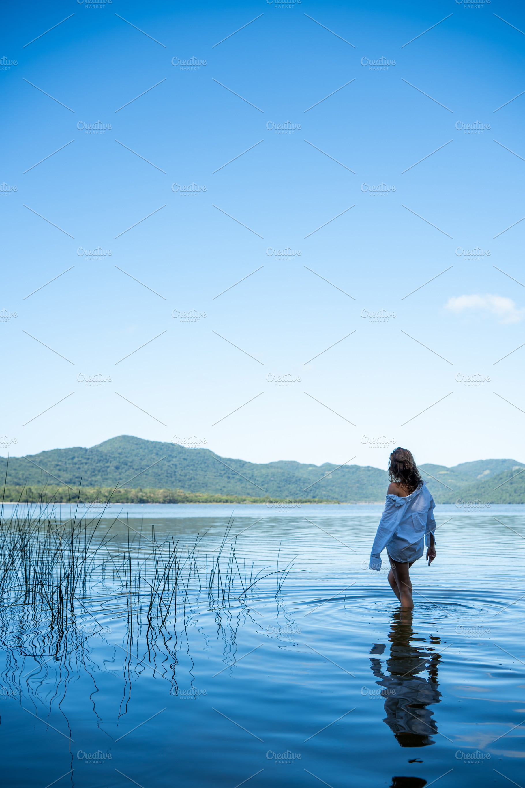 Woman Walking in Lake, a Photo by HiLine