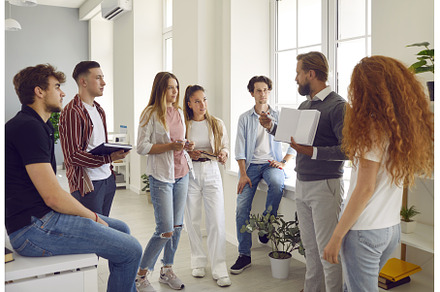 Group of students listening a
