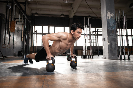 muscular man doing a pushups at gym, a Sports & Recreation Photo by OPOLJA
