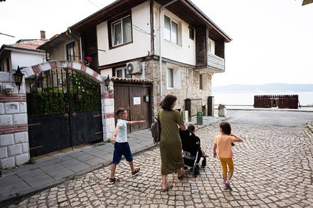 Mother and children walking in the old town Nessebar, Bulgaria., a Person Photo by AS photostudio