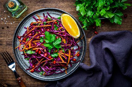 Coleslaw red cabbage salad with carrot, parsley, pomegranate and, a Food & Drink Photo by 5PH