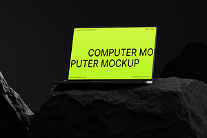 Computer Mockup on Dark Stone