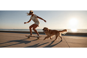 Carefree Woman Skateboarding with, a Sports & Recreation Photo by piter.goskov