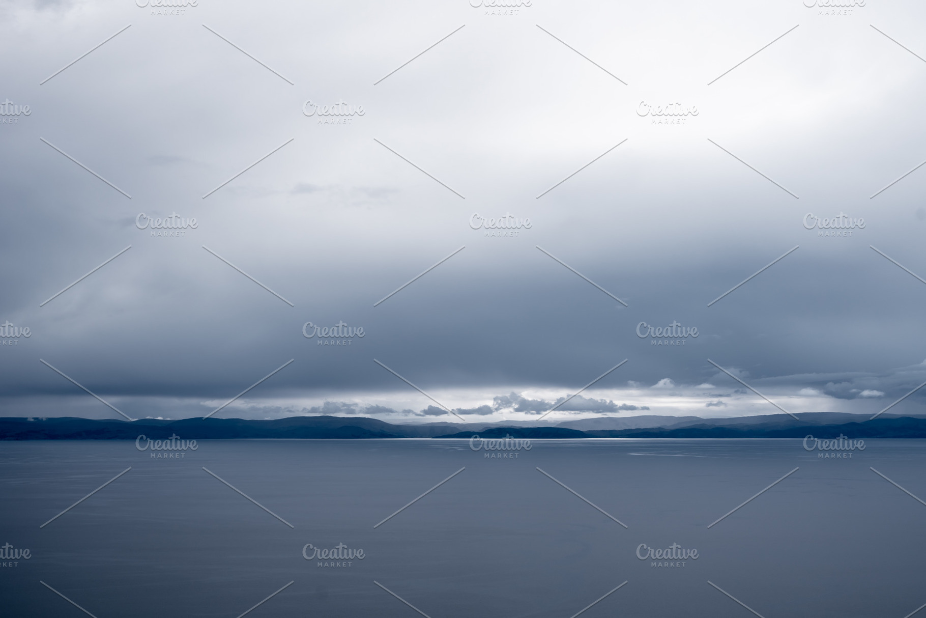 View of Lake Titicaca from Amantani Island under stormy clouds, a Nature Photo by GoodGoods