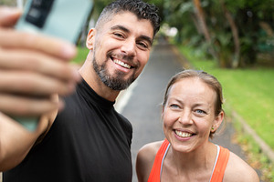 Smiling personal trainer taking a selfie with a mature female, a Sports & Recreation Photo by etorres69