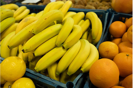 Fresh bananas in plastic boxes on, a Food & Drink Photo by oksix
