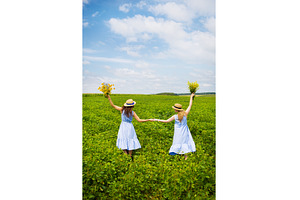 Two friends hold hands with a, a Nature Photo by Artsaba Family