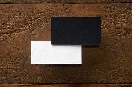 Modern business card mockup template on wooden background, a Business Photo by Asya Nurullina