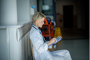 Young female doctor with short hair, a Person Photo by HalfPoint