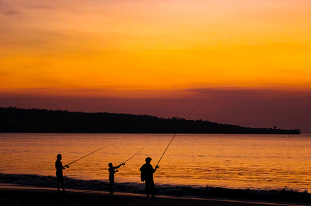 Fishermen on the beach on the island containing fisherman, sea, and water, a Nature Photo by PhotoXab
