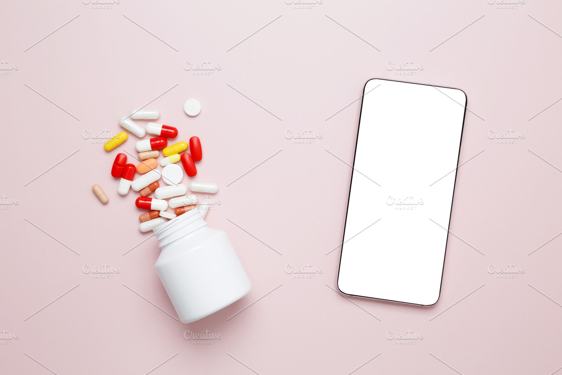 White bottle with colorful capsules and a smartphone on a surface, representing, a Photo by matucha