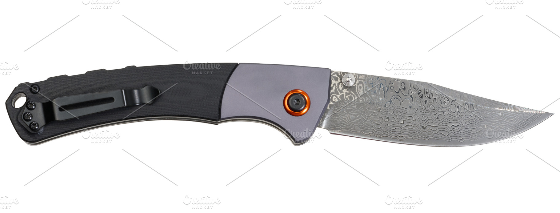 Folding knife with patterned Damascus steel blade and combinatio, an Industrial Photo by ndanko