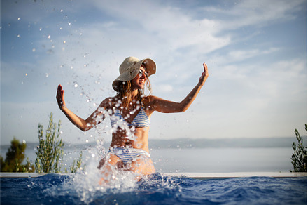 Young beautiful woman making water, a Person Photo by HalfPoint