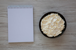 Organic White Mascarpone Cheese in a Bowl, top view., a Food & Drink Photo by LiudmylaChuhunova