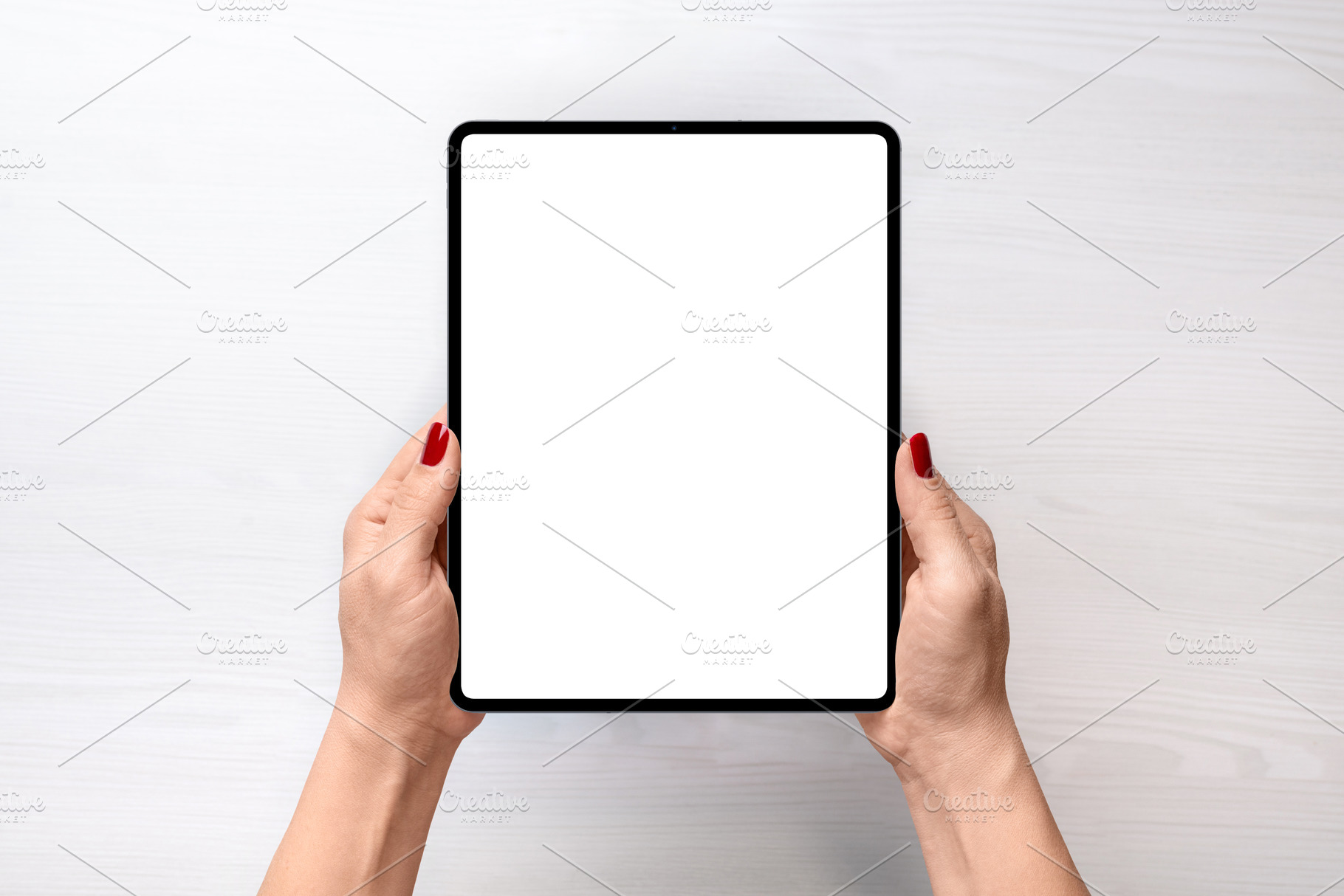Girl holding iPad Pro - top view, a Technology Photo by RSplaneta