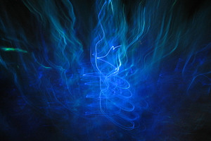 Whirling blue sea forms light art stock photograph