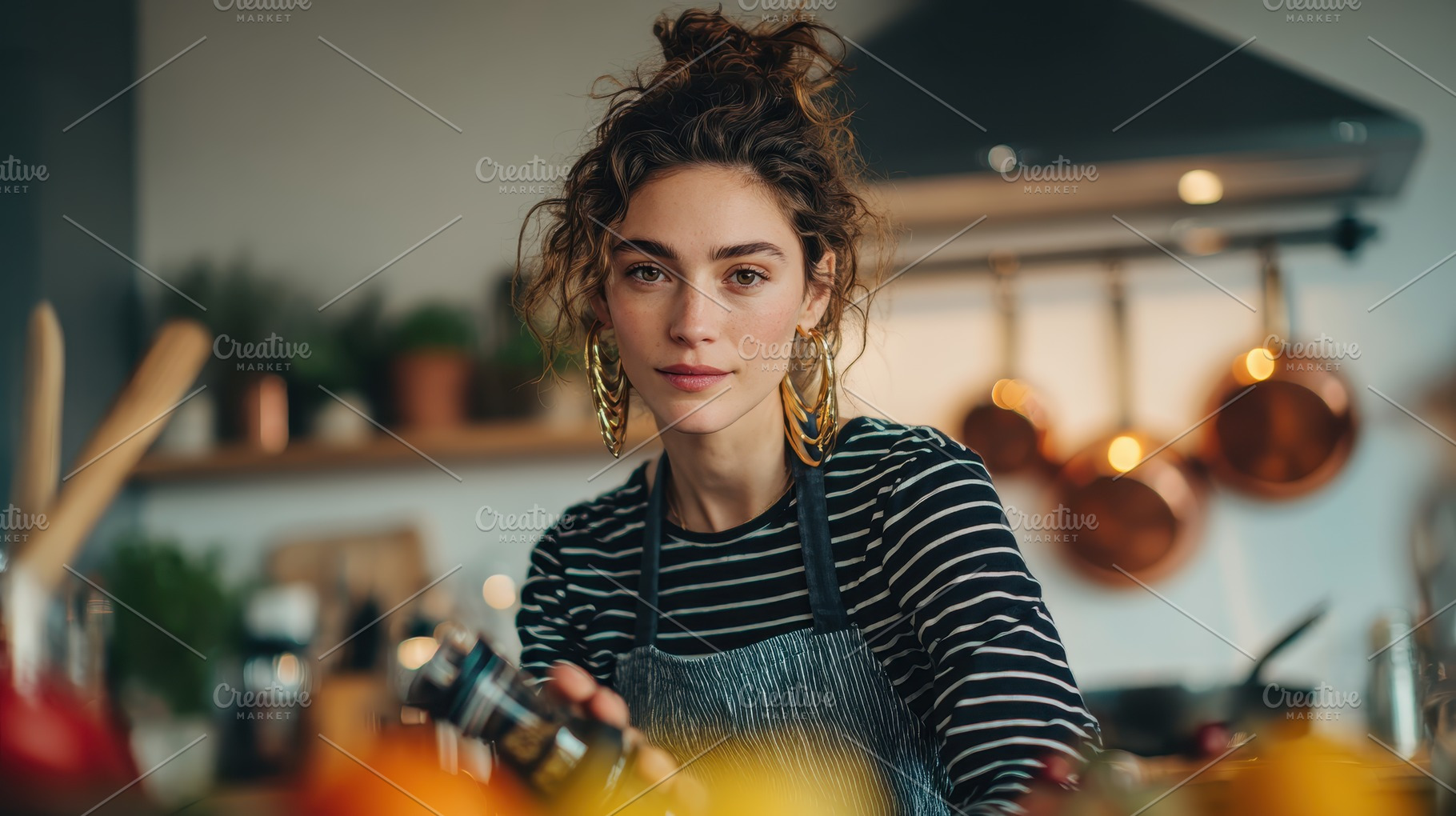 Young woman cooking in stylish kitch, a Photo by Pixeness Studio