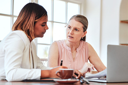 Mentor, leader and business woman coaching a young employee at new job via leadership and communication skills. Development, planning and project manager working, training and mentoring sales worker, a Photo by Peopleimages.com