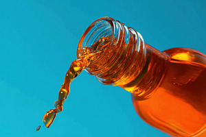 Liquid pouring from a bottle, a Photo by Beautiful things