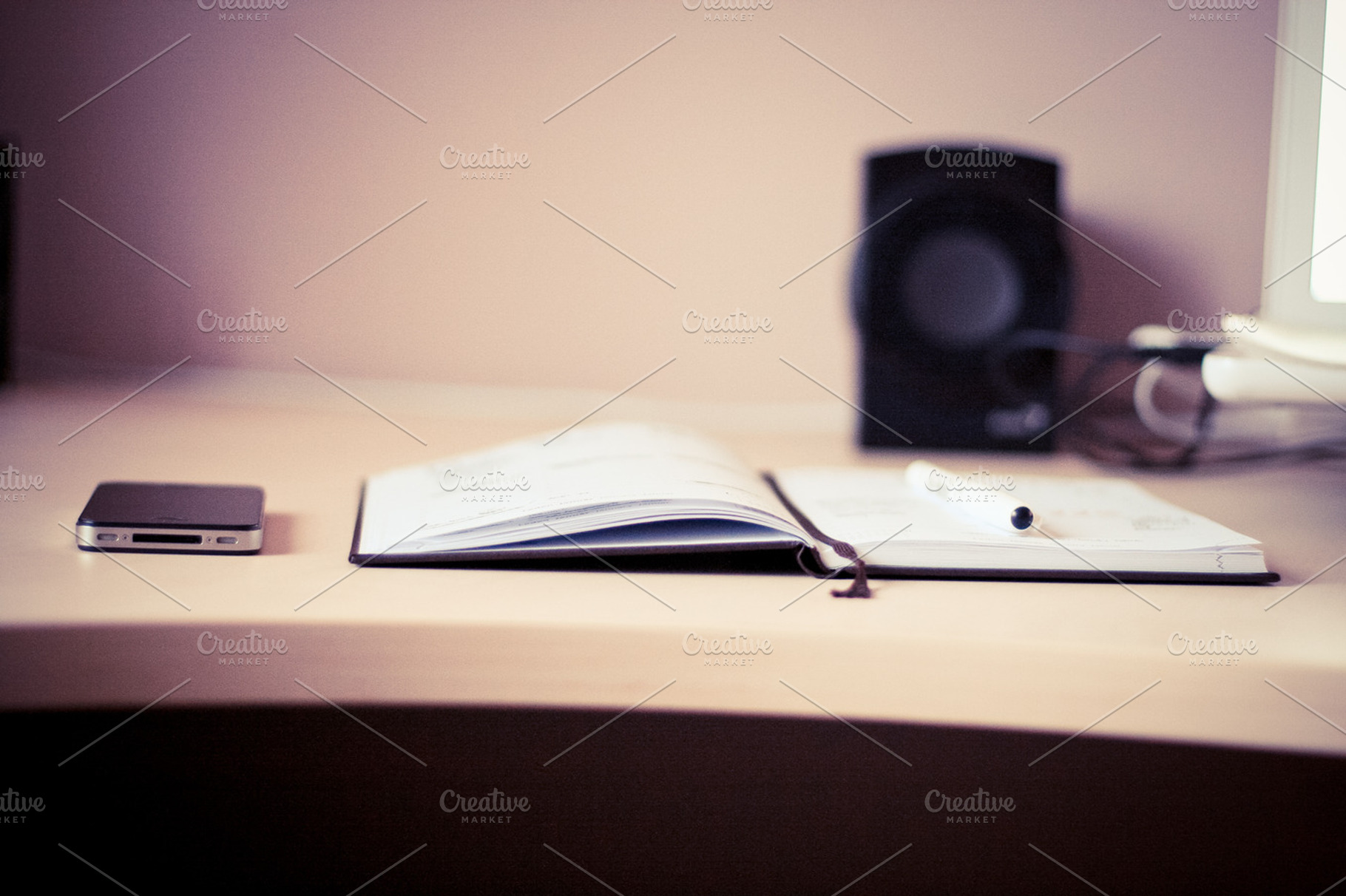 Black iPhone with a Diary