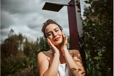 Beautiful woman touching her face, a Beauty & Fashion Photo by HalfPoint