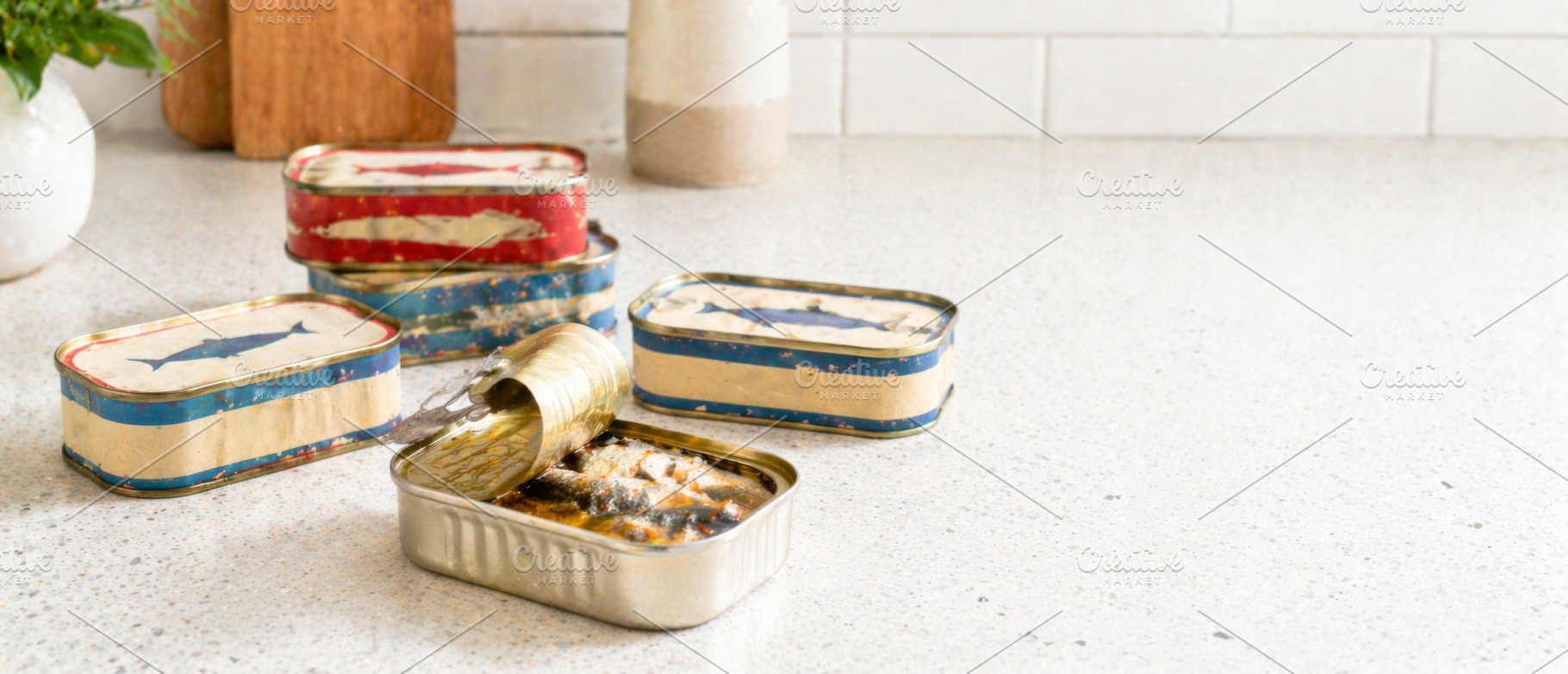 Sardine cans on kitchen counter with, a Photo by Dvoevnore photos